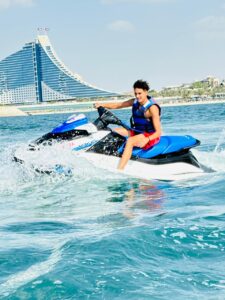 Jet ski tour riders zooming through Dubai’s waters with the city skyline