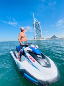 Jet ski riders cruising through the blue waters of Dubai