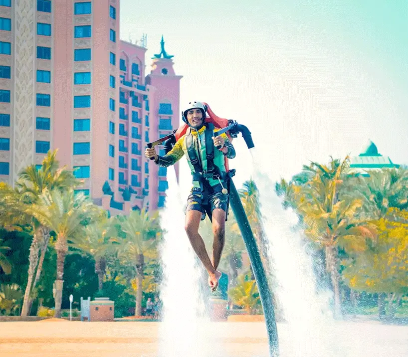 Rider soaring high above the water with a Jetpack