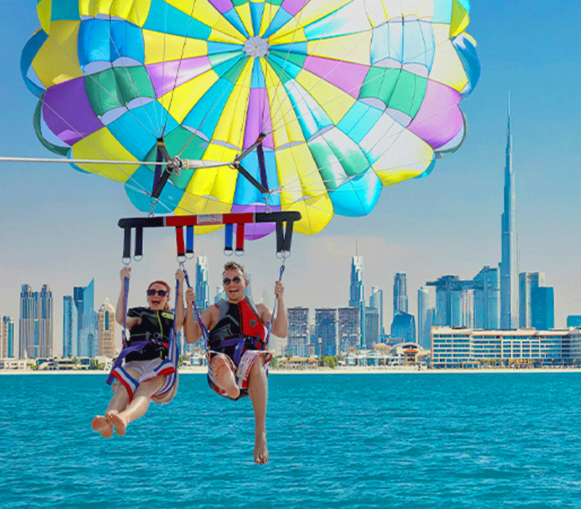 Parasailer soaring high above Dubai’s coastline, with stunning views of Dubai