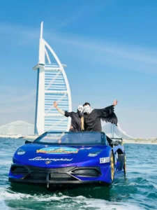 JetCar speeding across the sparkling waters of Dubai, with Burj Khalifa and Palm Jumeirah